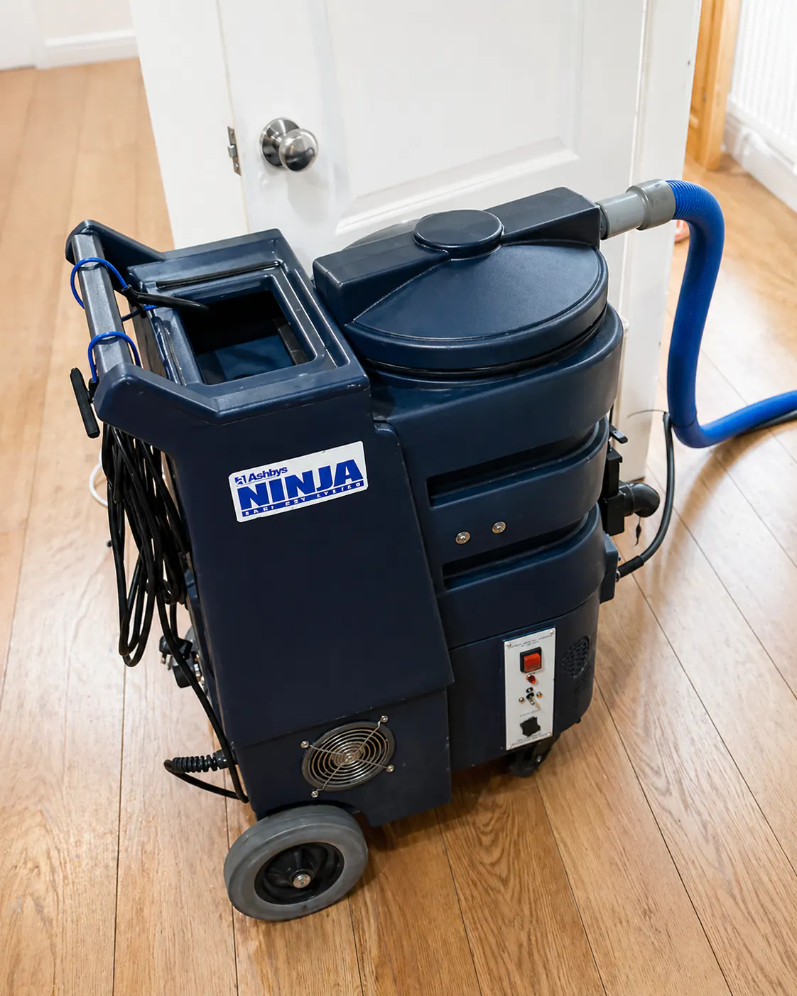 Professional hot-water extraction machine set up inside a home