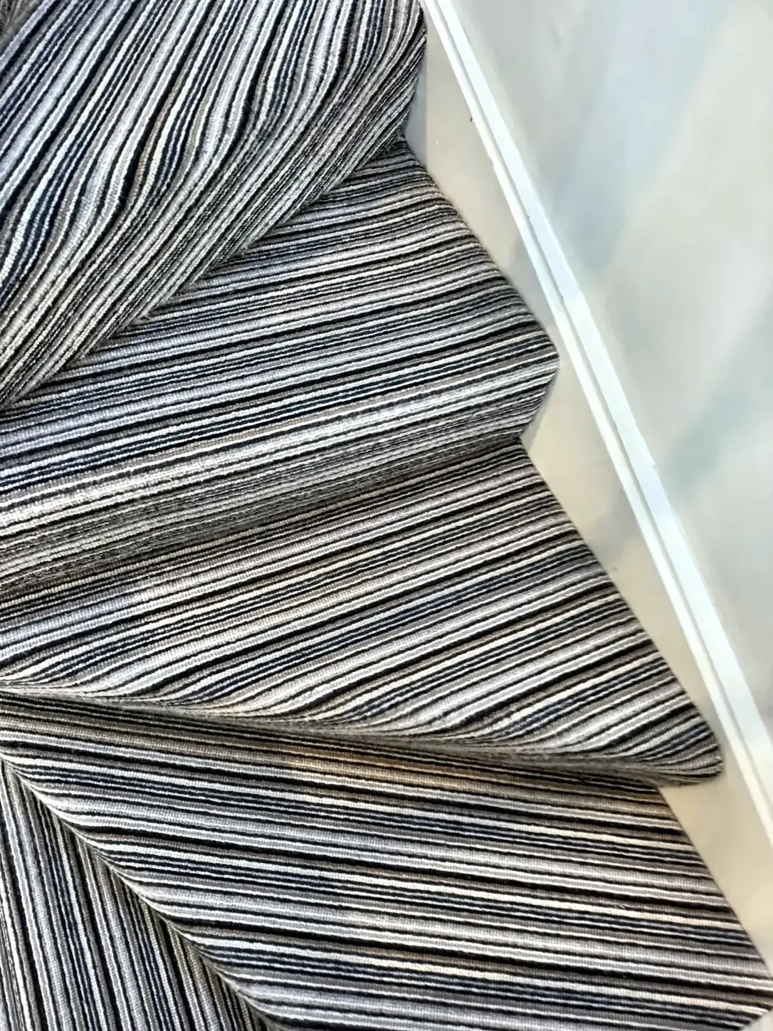 A striped stair carpet left clean after a stairs and landing clean.